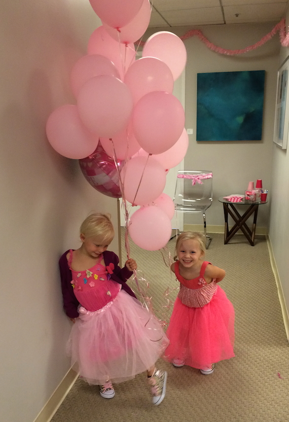 Dr. Horton’s twins with their favorite part of BRA Day, pink balloons!
