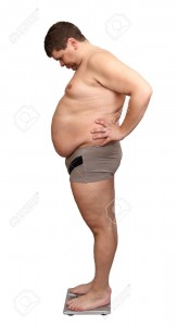 4794922-overweight-man-from-one-side-standing-on-scales-Stock-Photo-fat-men-overweight