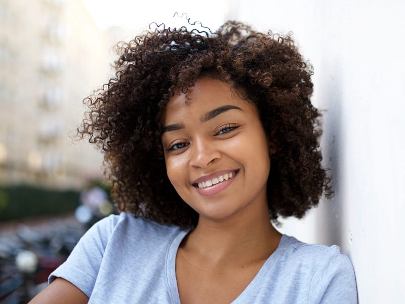 Pretty black woman smiling outside